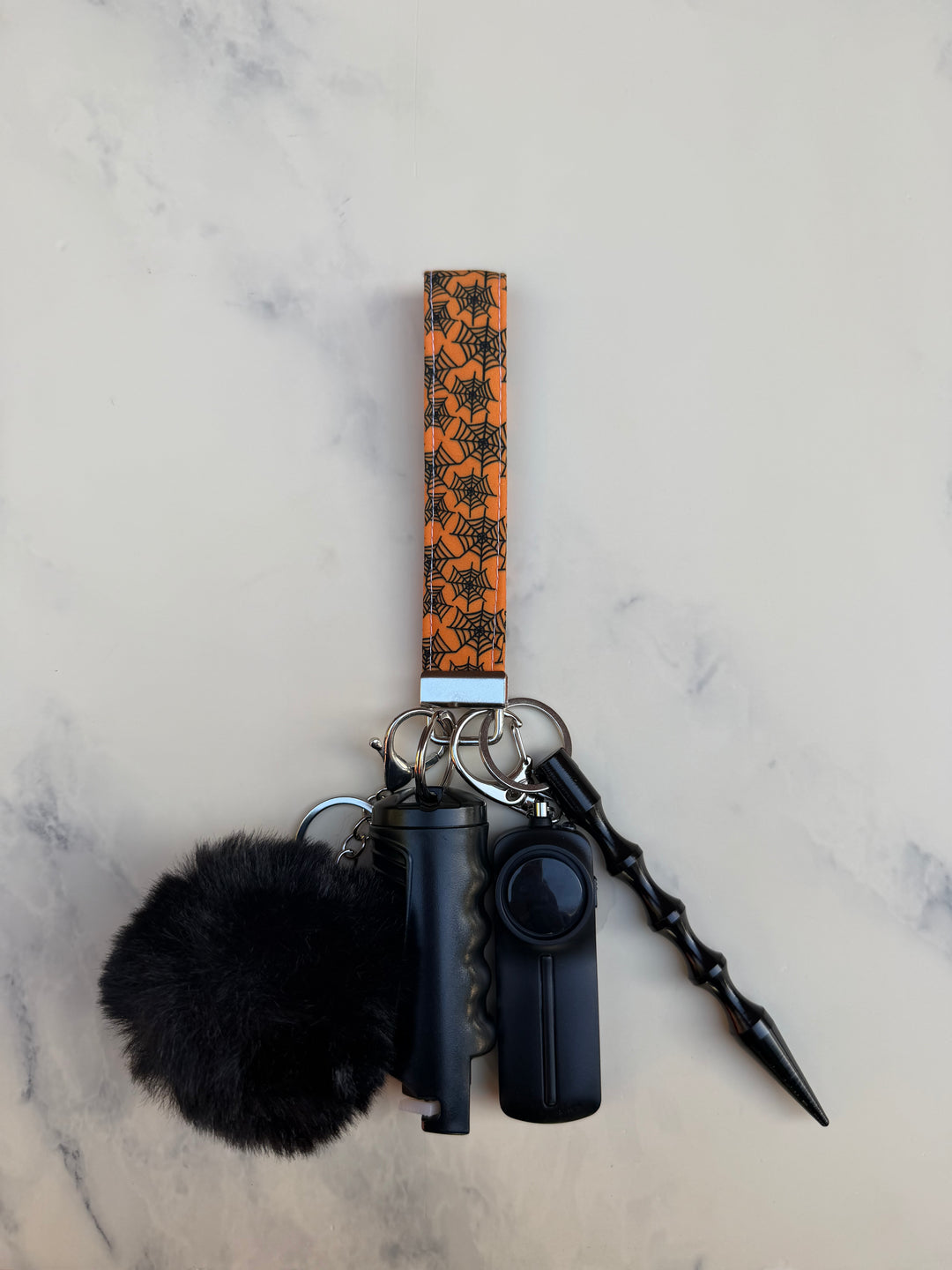Handmade orange spider web self-defense keychain
