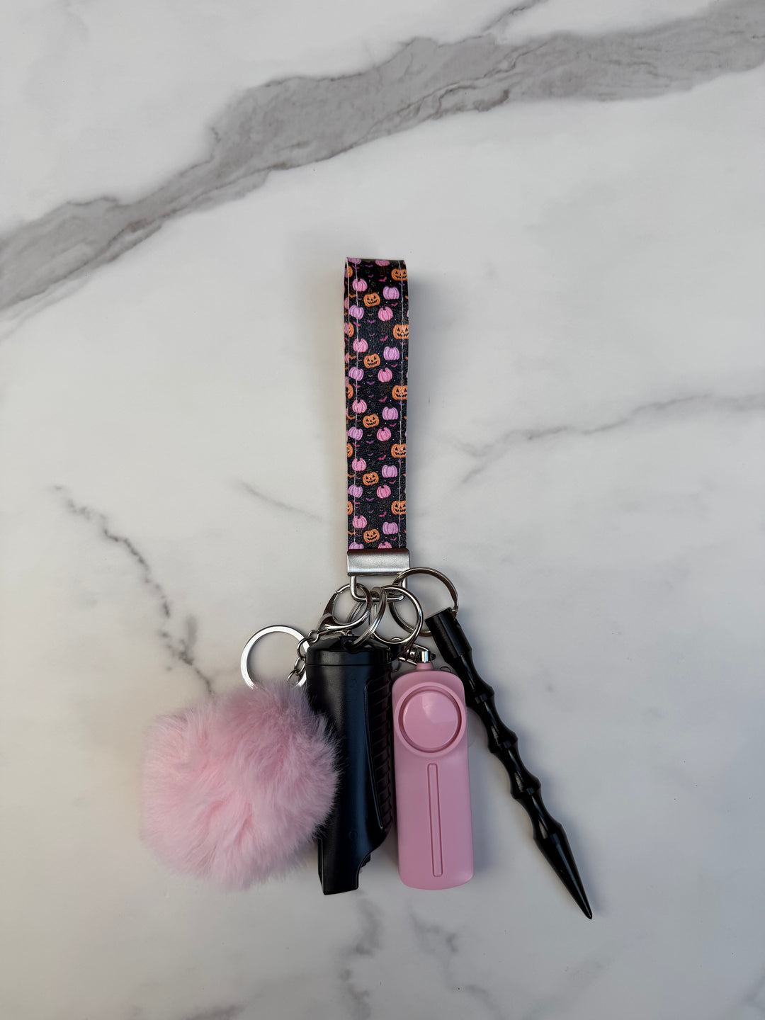 Handmade pink and black pumpkin self-defense keychain